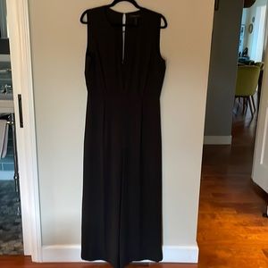 Sexy black pantsuit/jumpsuit. One piece with pockets and sheer VNeck BCBG